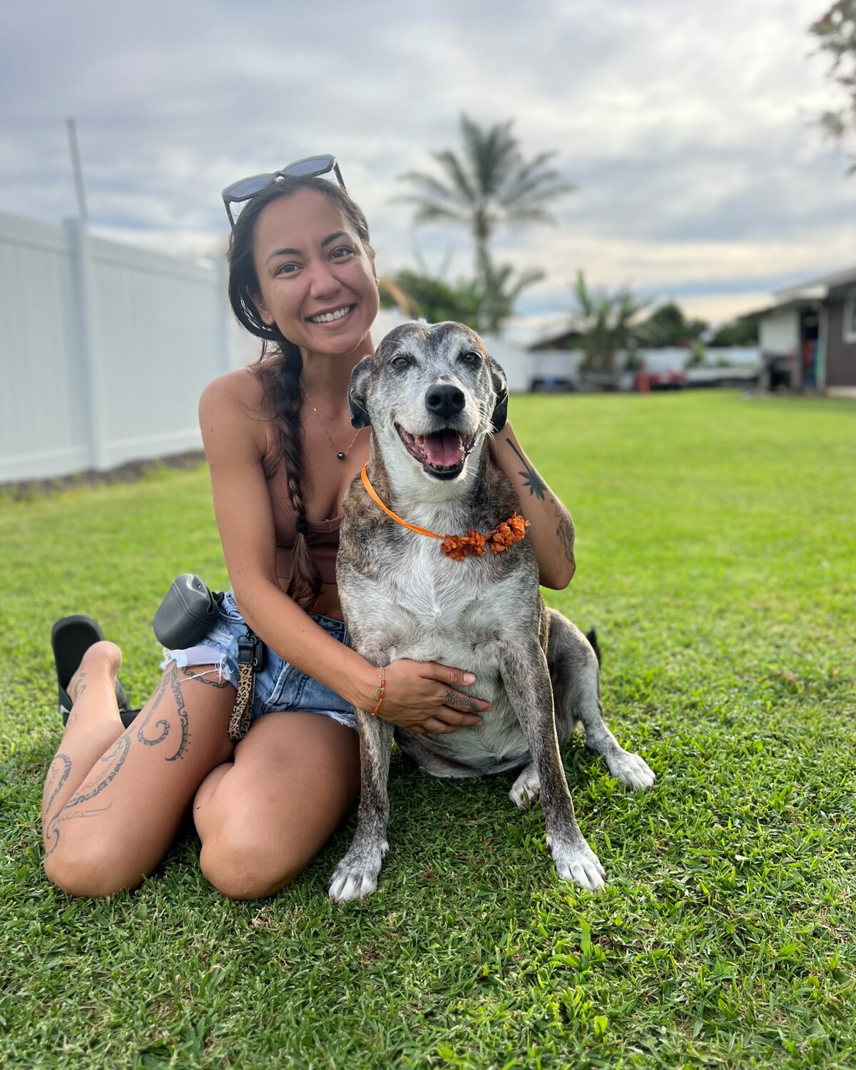 Justeen Naihe smiling with a happy dog